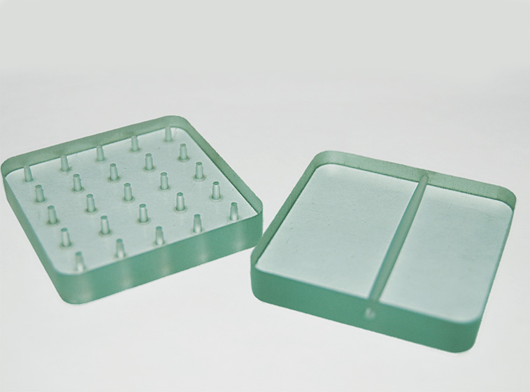 Waterjet Machine cutting intricate patterns on architectural glass panels
